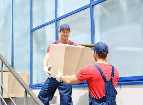 Moving van and house relocation scene in Harlington