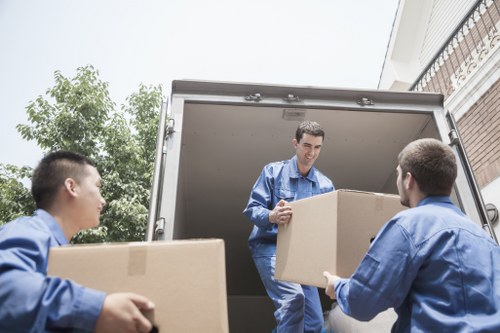 Local removal team packing household items in Harlington