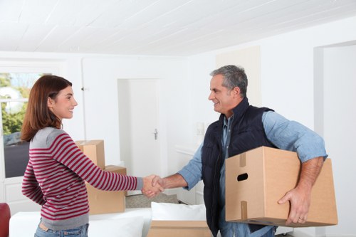 Professional movers loading belongings for a Harlington move