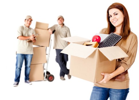Packed moving boxes and furniture ready for transport