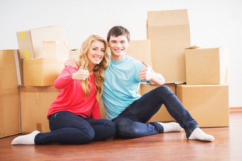 Careful loading of household items into a removals vehicle