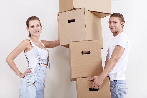 Local moving team handling boxes and furniture for a Harlington customer
