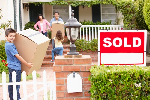 Loading furniture into a van for a Harlington home or flat move