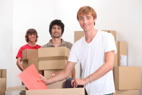 Team finishing a move with careful safety checks