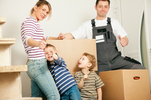Loading furniture into a hire truck for a Harlington relocation